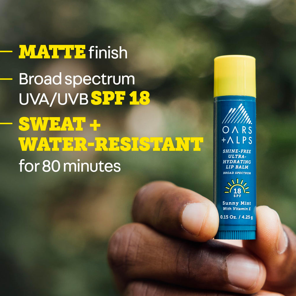 Oars + Alps in-use on lips, provides minty moisturization and UV defense