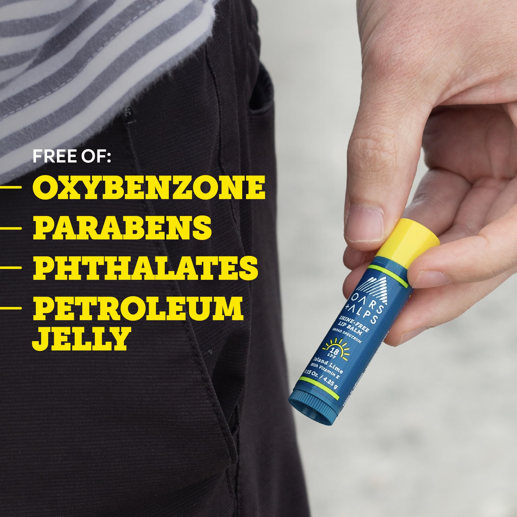 Oars + Alps lip sunscreen on a towel at beach showing outdoor protection