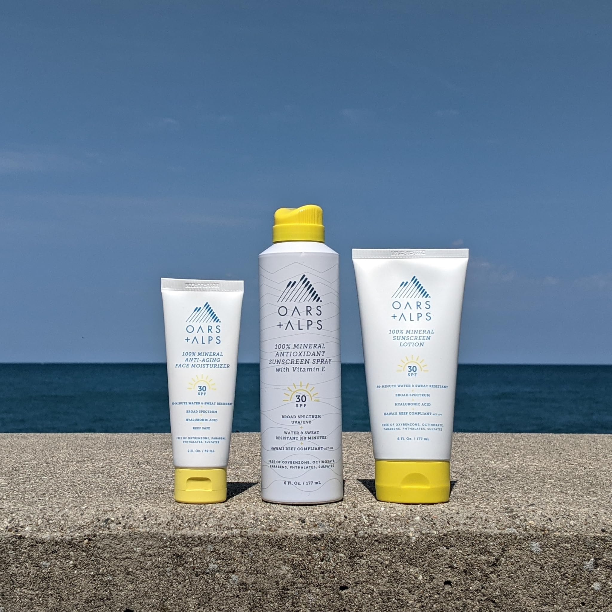 Oars + Alps bottle in hand showing 6oz scale and travel convenience