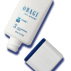 Obagi Medical Clear FX next to a ruler showing the 2 oz size for scale