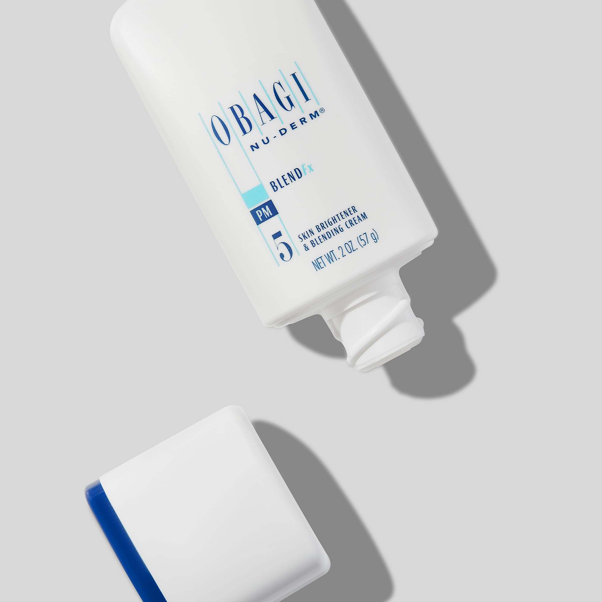 Obagi Medical hand applying cream showcasing easy nightly absorption benefit