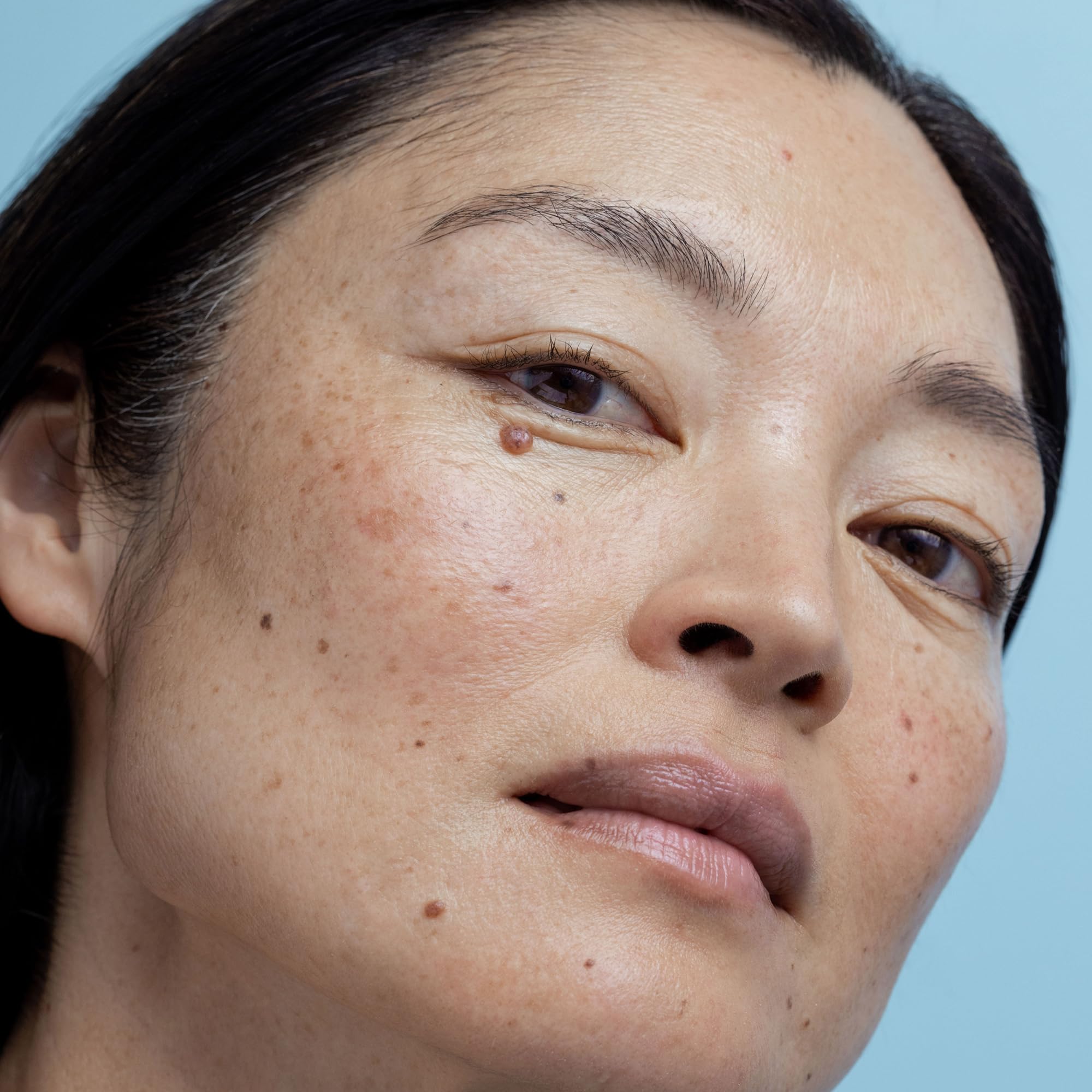 Obagi Medical being applied to cheek demonstrating smooth application benefit