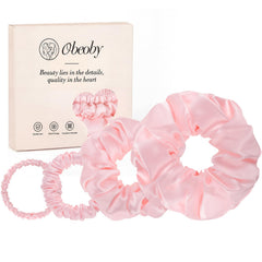 obeoby front packaging showing four pink scrunchies and travel convenience