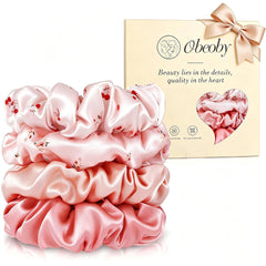 obeoby front packaging showing four pink silk scrunchies and gift box, elegant gift-ready
