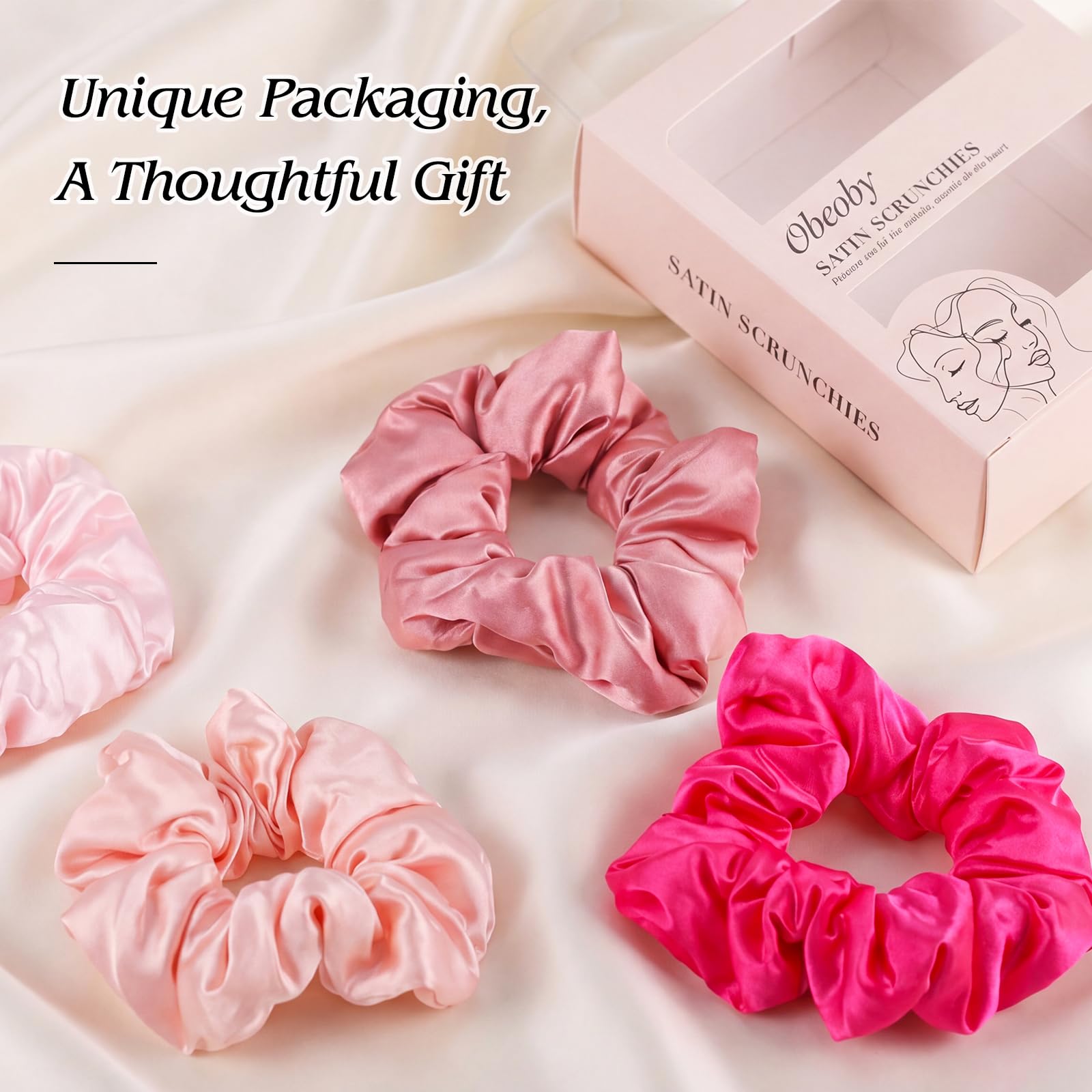 obeoby scrunchie beside hand to show size and secure fit benefit