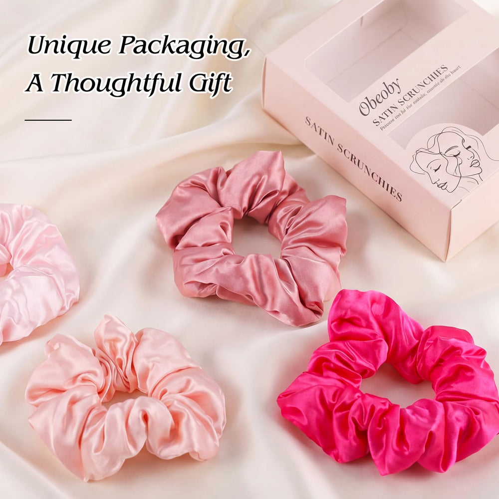 obeoby scrunchie beside hand to show size and secure fit benefit