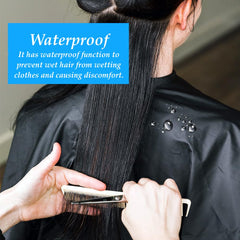 OBTANIM cape in use with stylist cutting hair, reducing mess