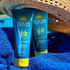 Ocean Potion travel size tucked into summer bag for on-the-go protection