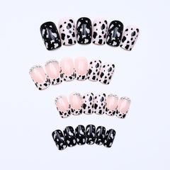 OCOUYVD close-up of cow-print accent nail highlighting bold pattern