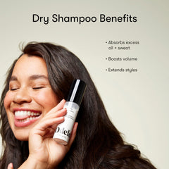 Applying Odele powder to roots with fingertips for instant lift