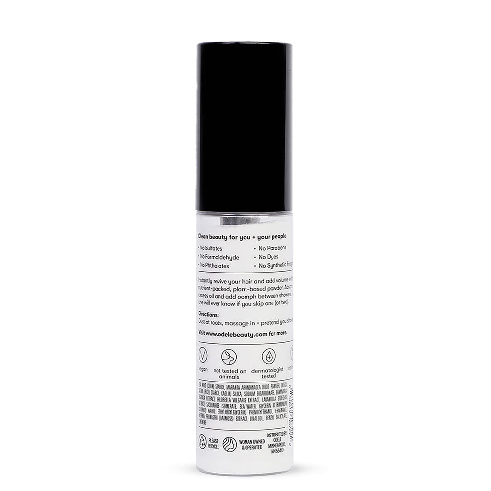 Person refreshing hair midday using Odele for fuller looking hair