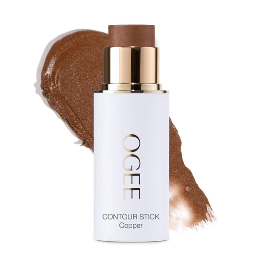 Ogee bronzer stick front view showing compact packaging and warm copper tone benefit