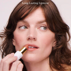 Ogee applied on lips in use demonstrating flattering magenta and long-lasting wear benefit