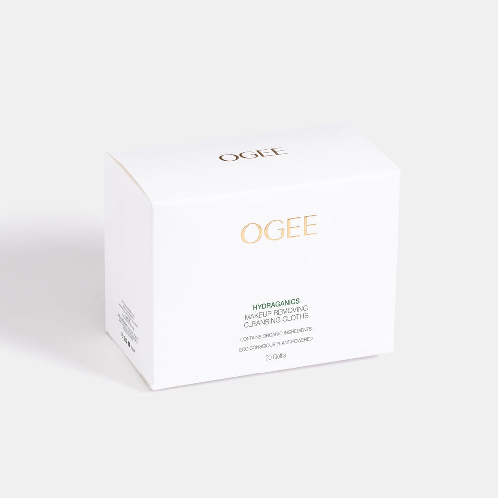 Ogee wipe next to credit card showing compact portable size