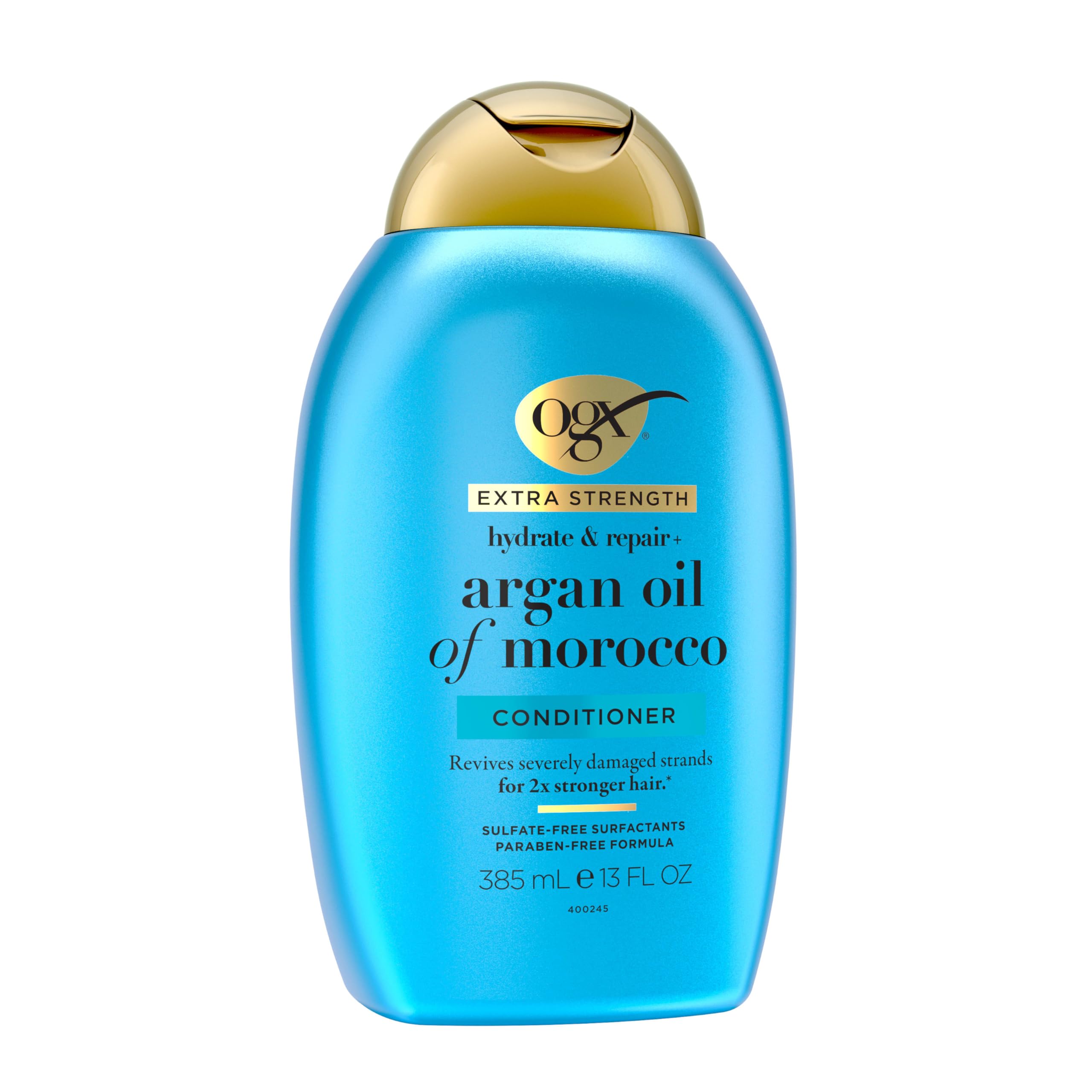 OGX applying conditioner to mid-lengths demonstrating detangling benefit
