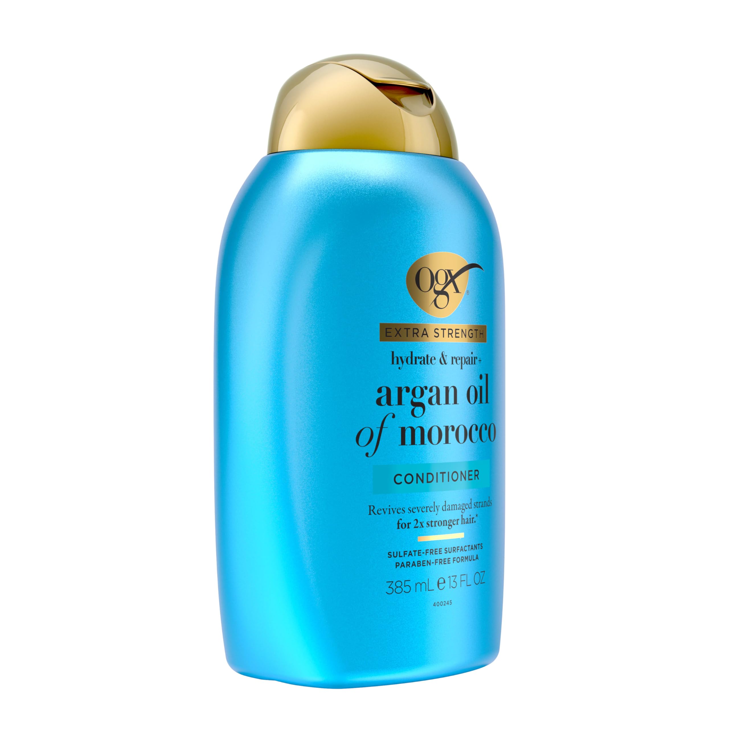 OGX conditioner bottle held in hand to show 13 fl oz size and scale