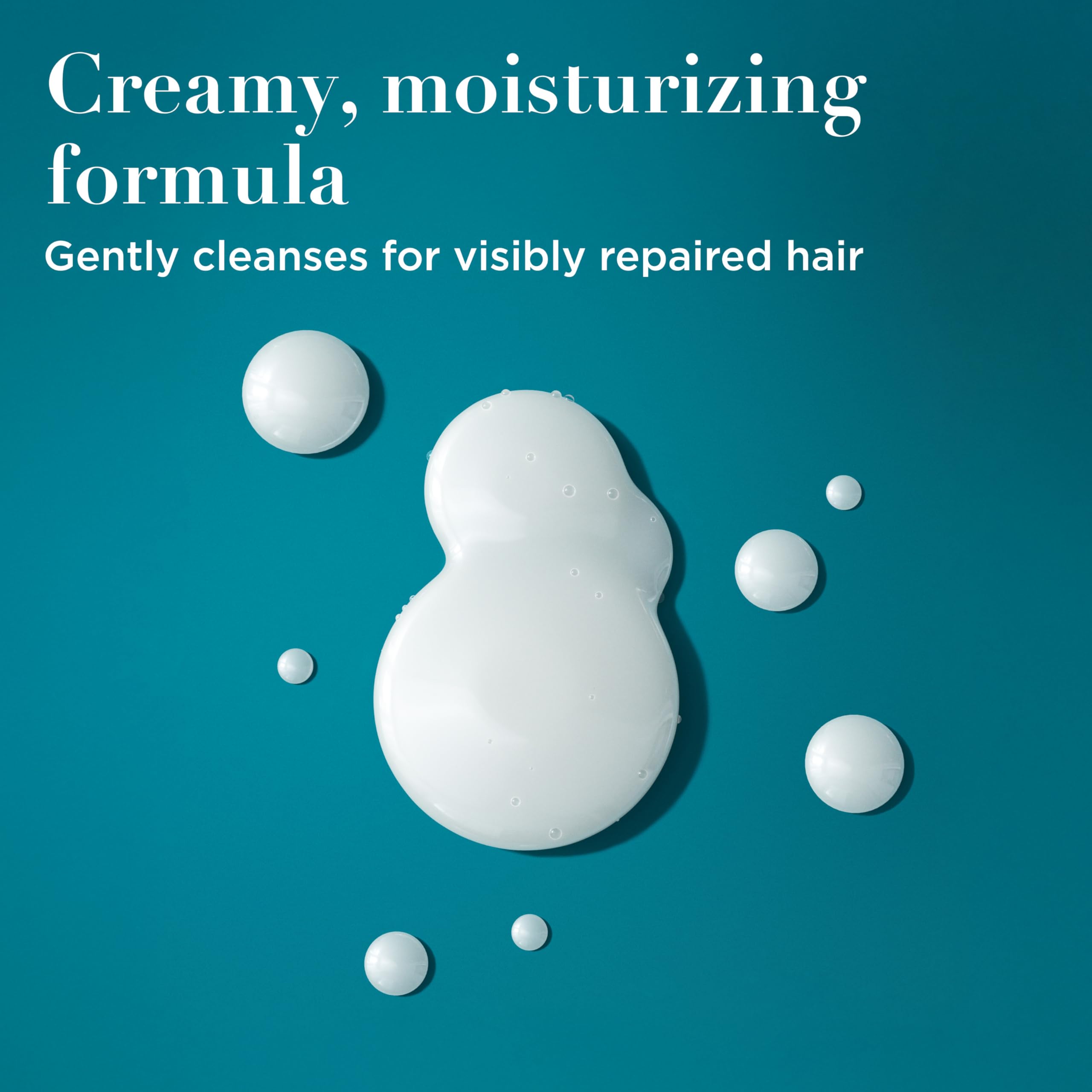 OGX creamy lather texture on hand demonstrating gentle, nourishing cleansing