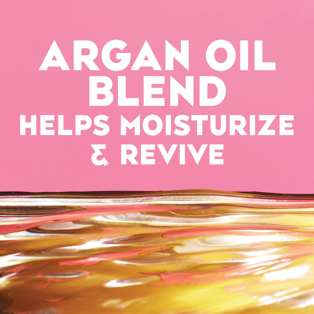 OGX cold-pressed argan oil pouring to show nourishing ingredient and shine boost