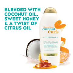 OGX dispensed conditioner on palm demonstrating creamy slip and detangling