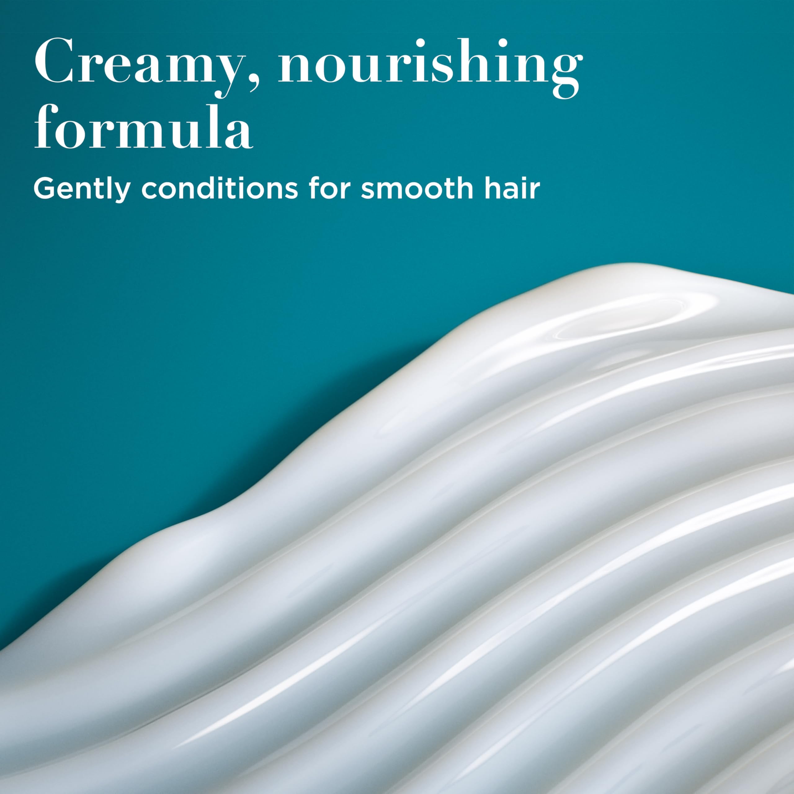 OGX creamy conditioner texture close-up showing moisturizing consistency