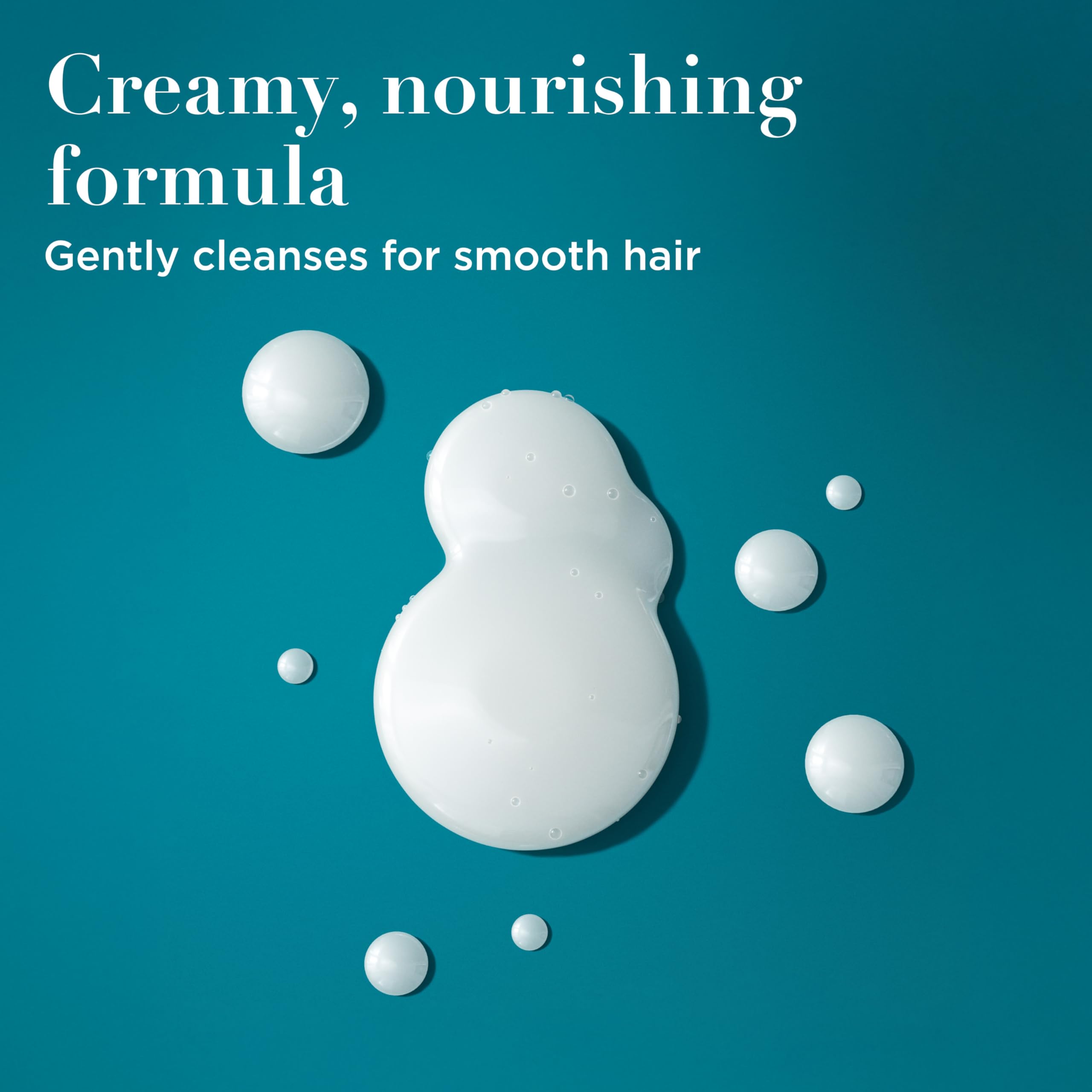 OGX creamy shampoo texture swirled to show luxurious hydration