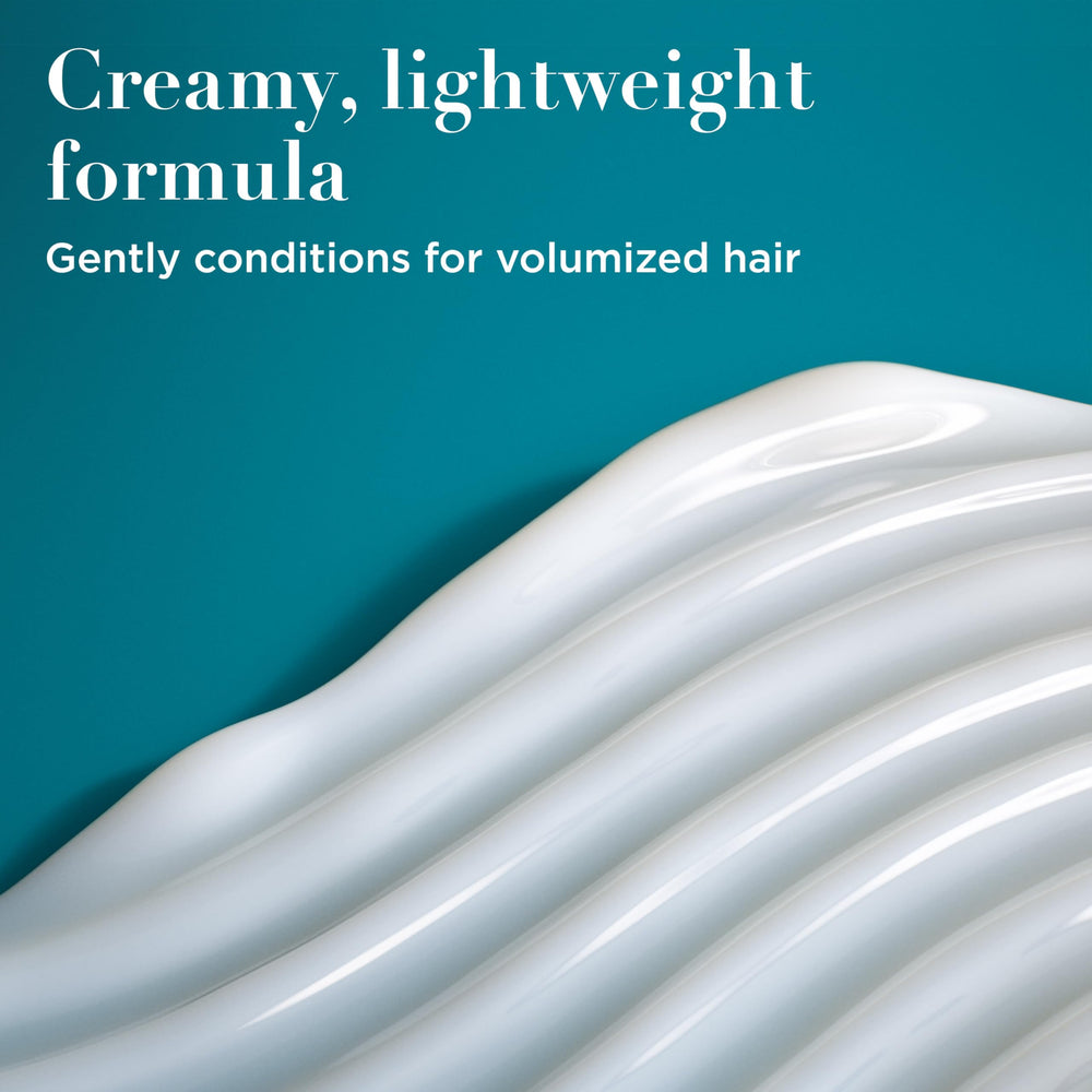 OGX conditioner texture dollop showing creamy consistency and smooth application benefits