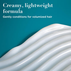 OGX conditioner texture dollop showing creamy consistency and smooth application benefits