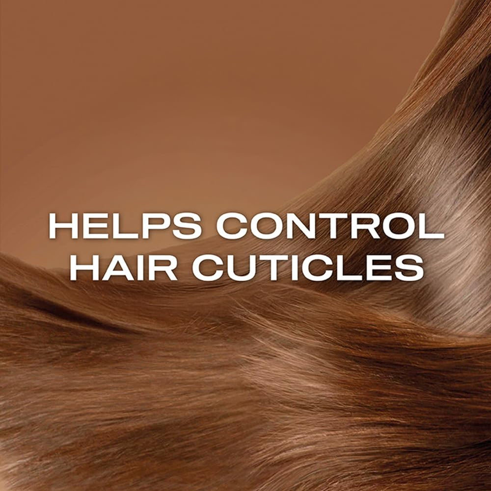 OGX shampoo paired with matching conditioner for a complete smoothing system