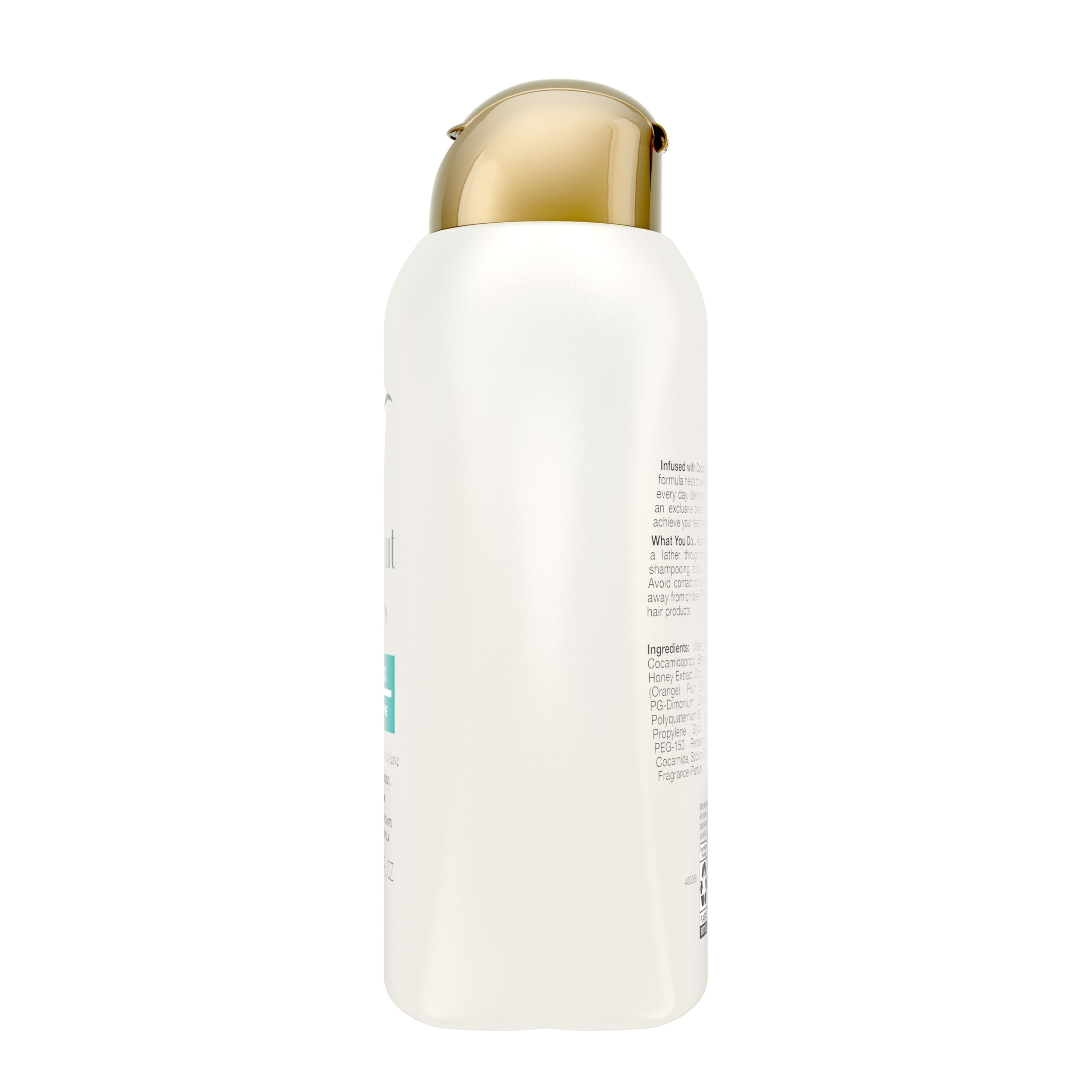 OGX bottle in hand for scale showing 13 fl oz size and portable convenience