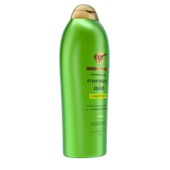 OGX 25.4 fl oz bottle in hand showing scale and long-lasting supply