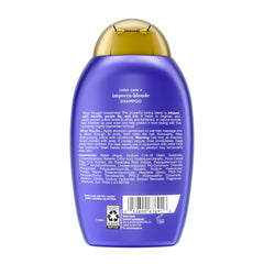 OGX bottle beside hand for size scale and travel-friendly insight