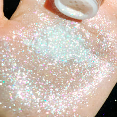 Eye swatch of Okerker glitter demonstrating bright sparkle payoff