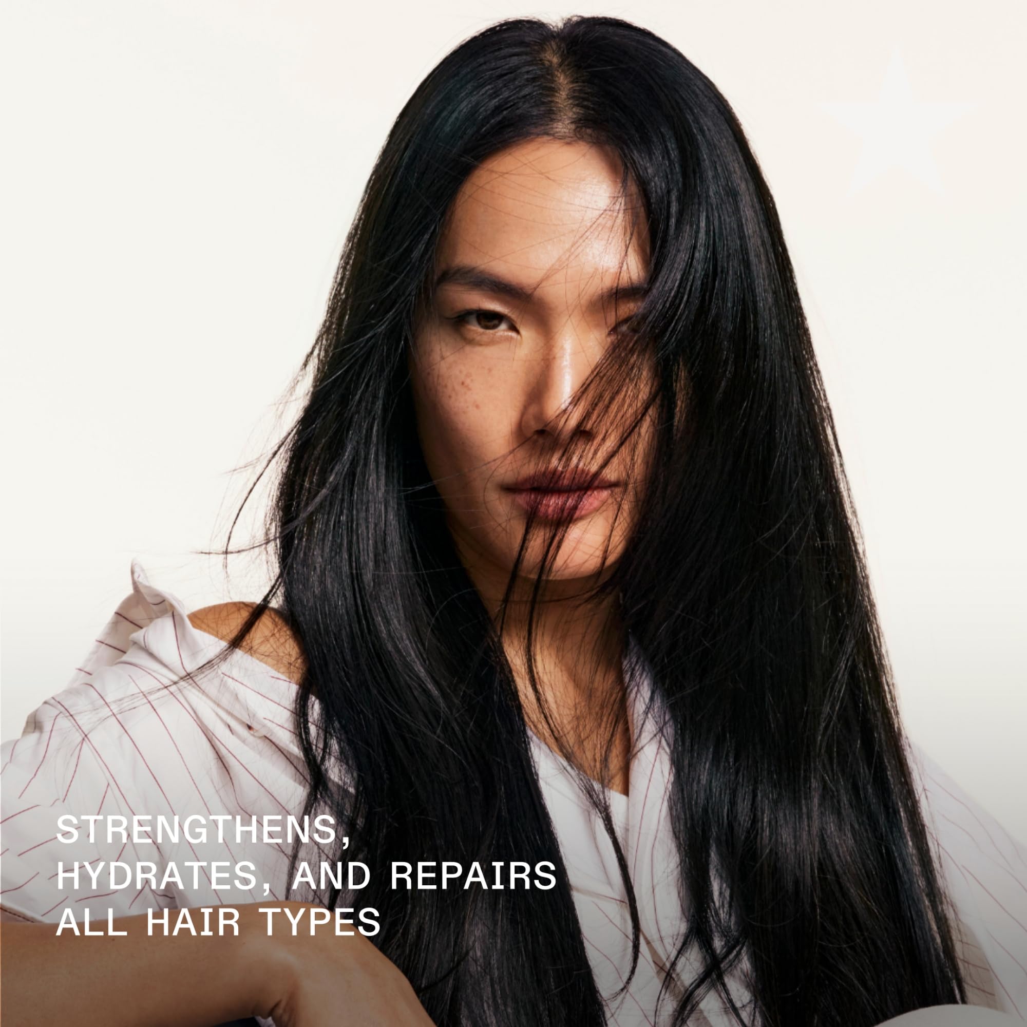 Olaplex Nº.4 pouring consistency on hand showing concentrated formula benefit