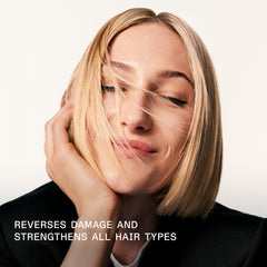 Applying Olaplex No.3 to damp hair for effective bond repair