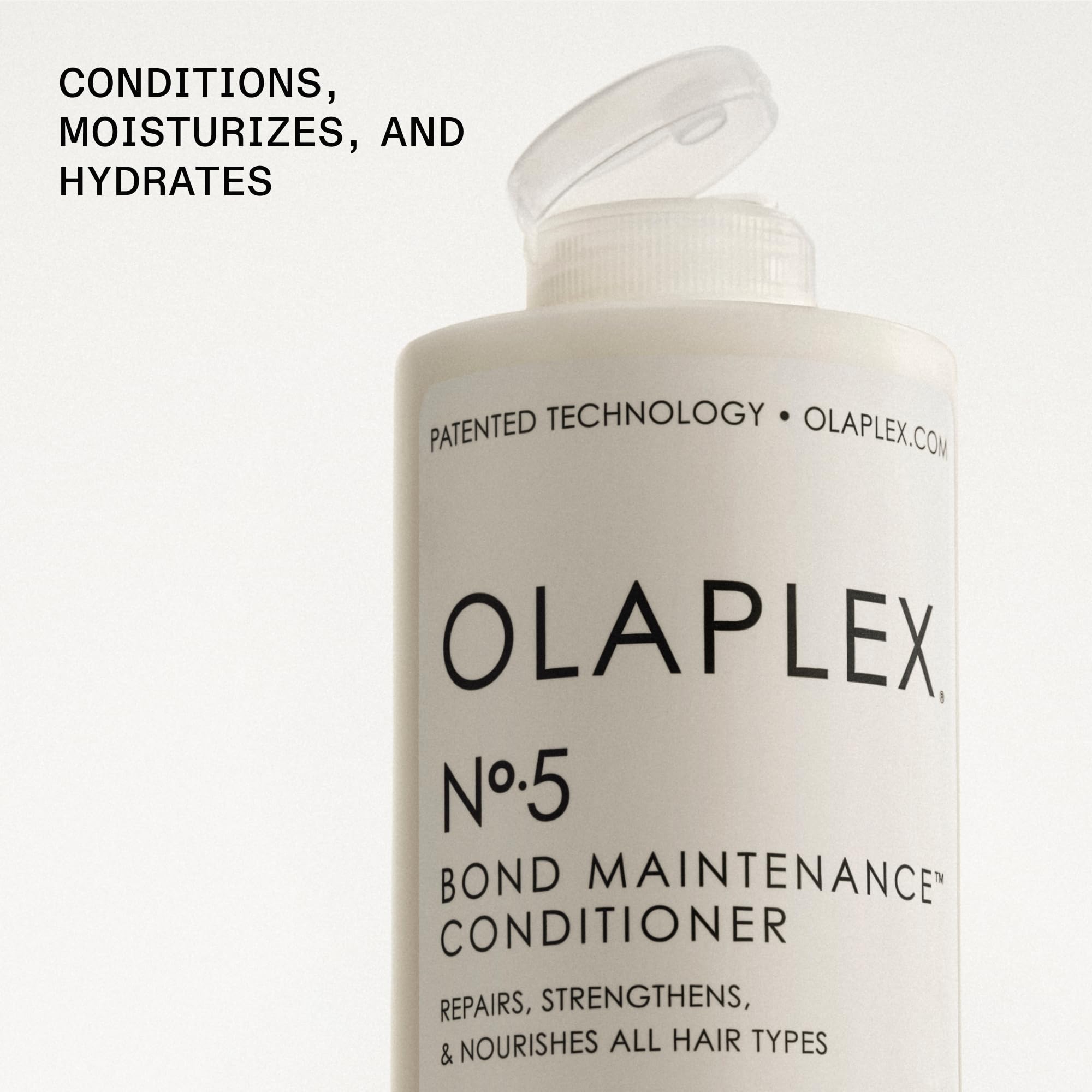 Applying Olaplex No.5 to mid-lengths and ends demonstrating detangling and strength benefits