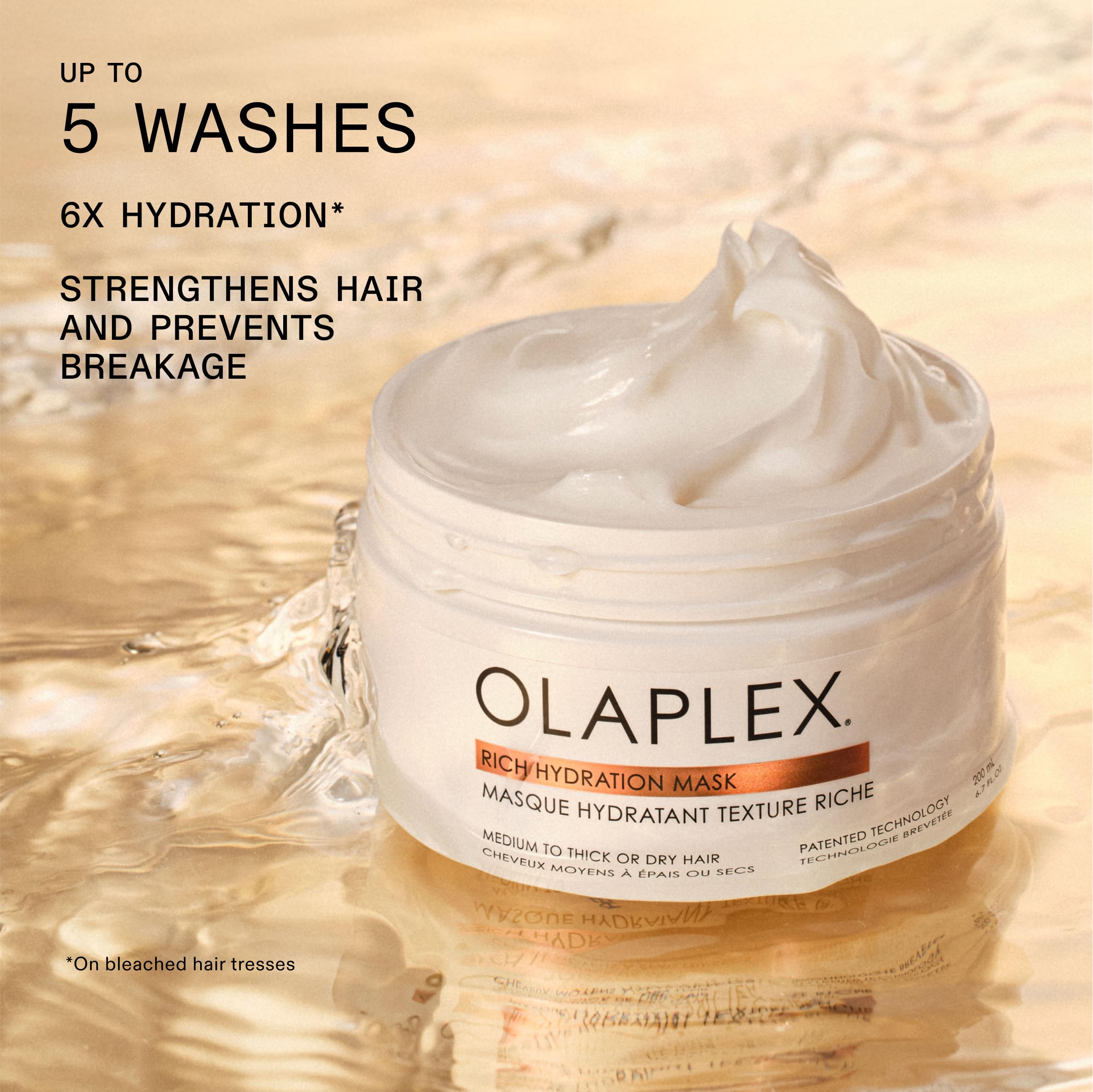 Olaplex mask being applied to damp hair demonstrating improved hydration