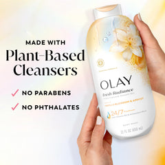 Olay bottle beside common water bottle for scale, shows generous 22 fl oz size