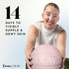 Olay bottle placed by folded towel illustrating bathroom-ready skincare convenience