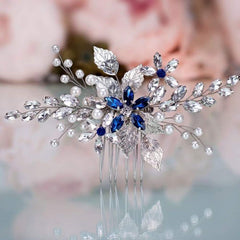 Olbye front view of blue rhinestone comb showing elegant shape and sparkle