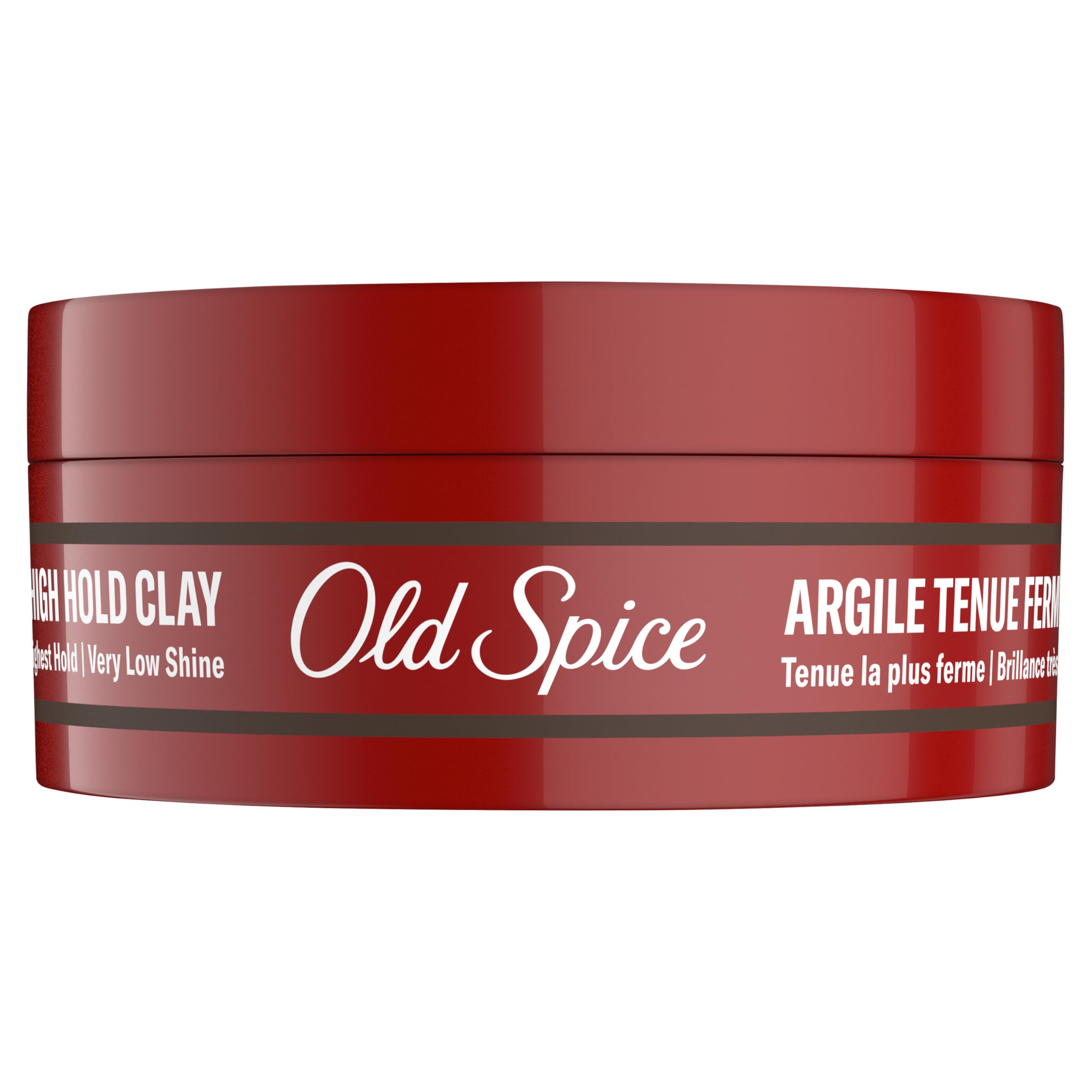 Man in barbershop styling hair using Old Spice clay demonstrating professional results