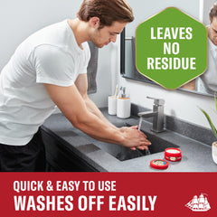 Applying Old Spice Fiji pomade between hands for even distribution and easy styling