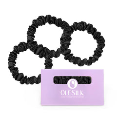 OLESILK front packaging showing three black silk scrunchies, elegant gift-ready
