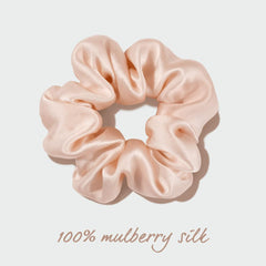 OLESILK scrunchie next to a ruler showing scale and suitable size for all hair types benefit