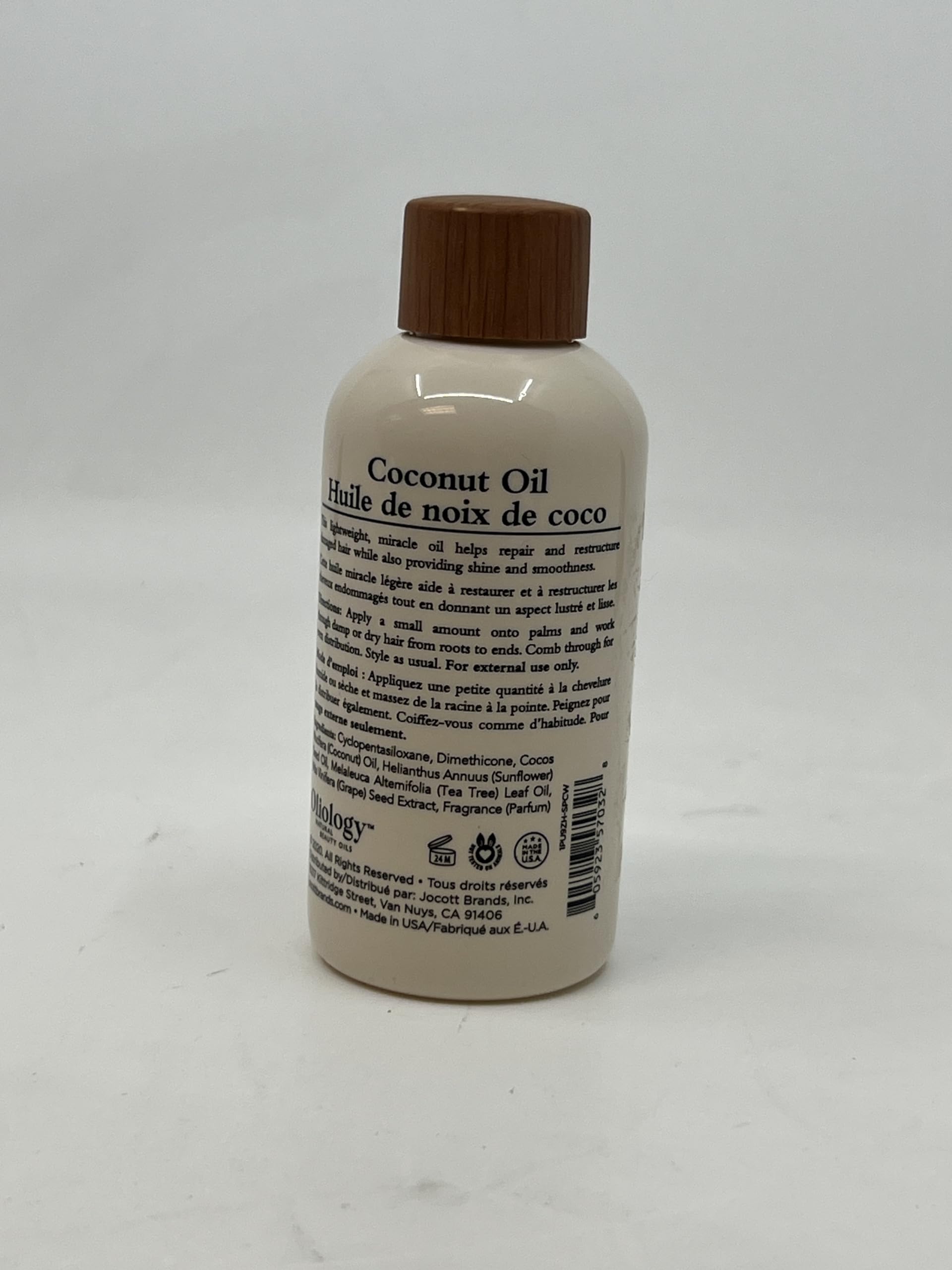 Oliology 4oz bottle beside a ruler to show true size and portability