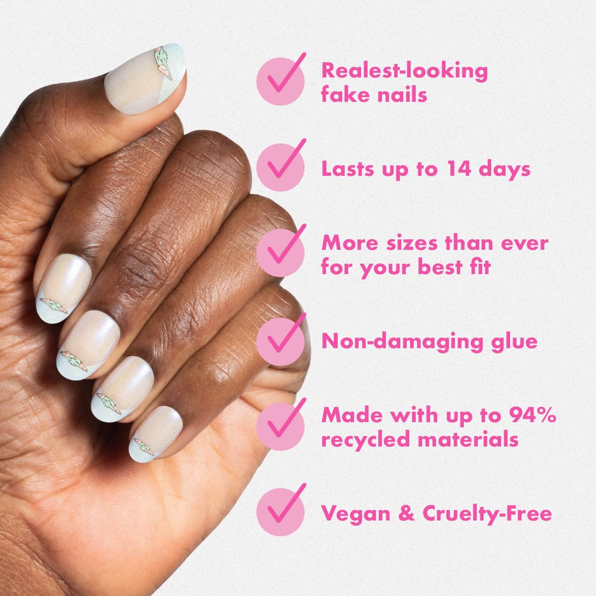 Olive & June hand applying press-on nail with glue demonstrating quick secure application