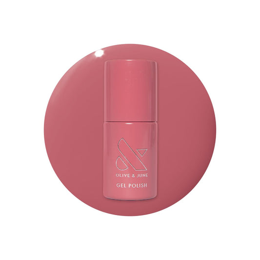 Olive & June bottle front packaging showing boysenberry color and brand benefit