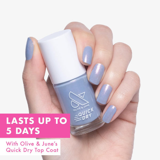 Olive & June fan-shaped brush close-up for streak-free easy application