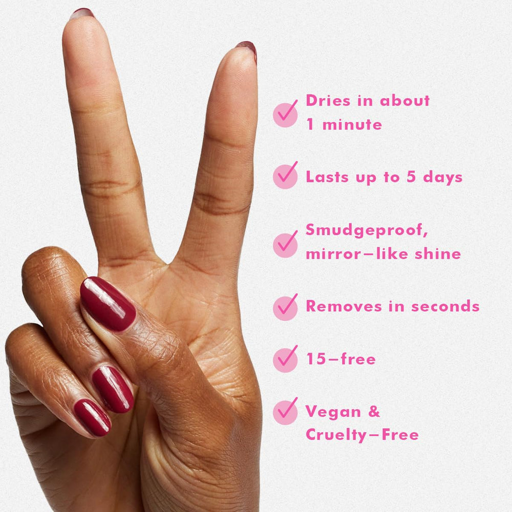 Olive & June finished manicure on hands highlighting salon-quality glossy red and chip resistance
