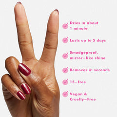 Olive & June finished manicure on hands highlighting salon-quality glossy red and chip resistance