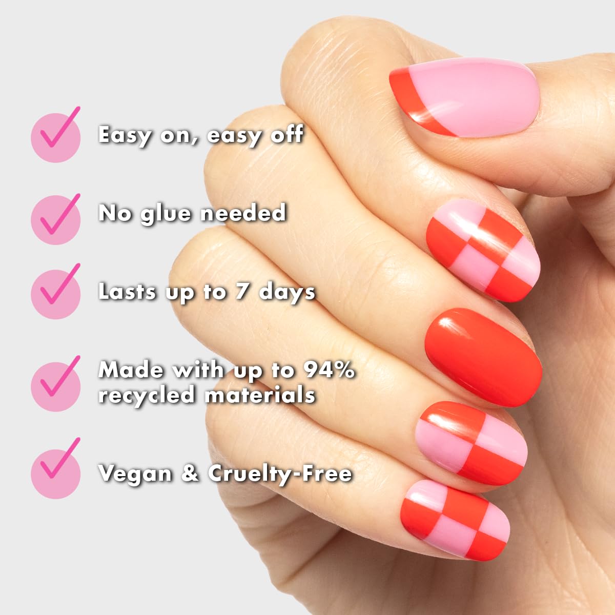 Close-up of Olive & June press-on nail pink checker pattern, showcasing realistic salon finish